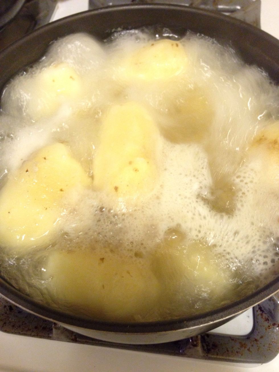 Boiling the potatoes! First make sure to have a big enough saucepan to boil your potatoes. Put the potatoes into the saucepan whole and fill with water. Boil at a high temperature for 30 to 45 minuets