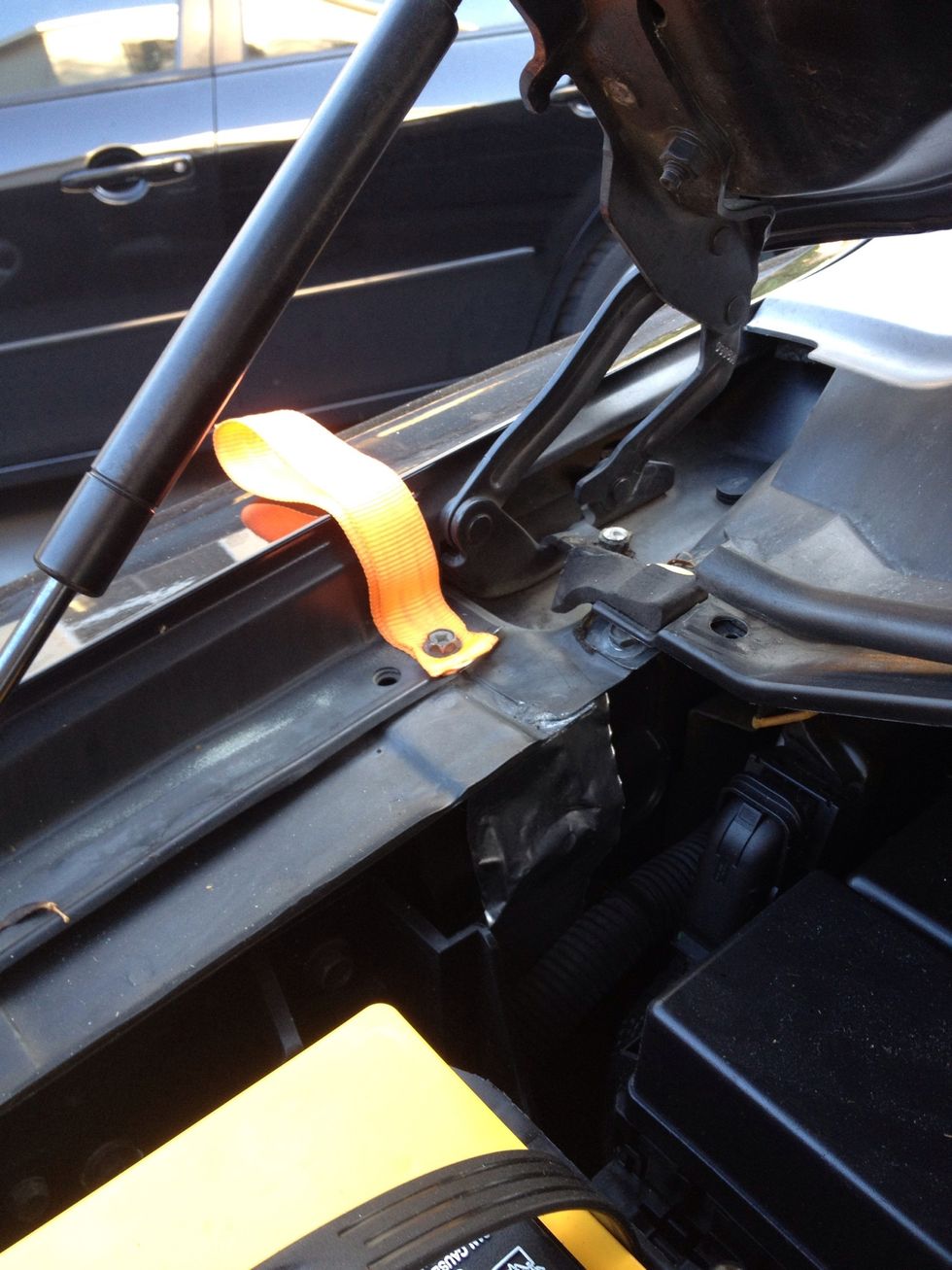 Bolt it back with the strap facing out