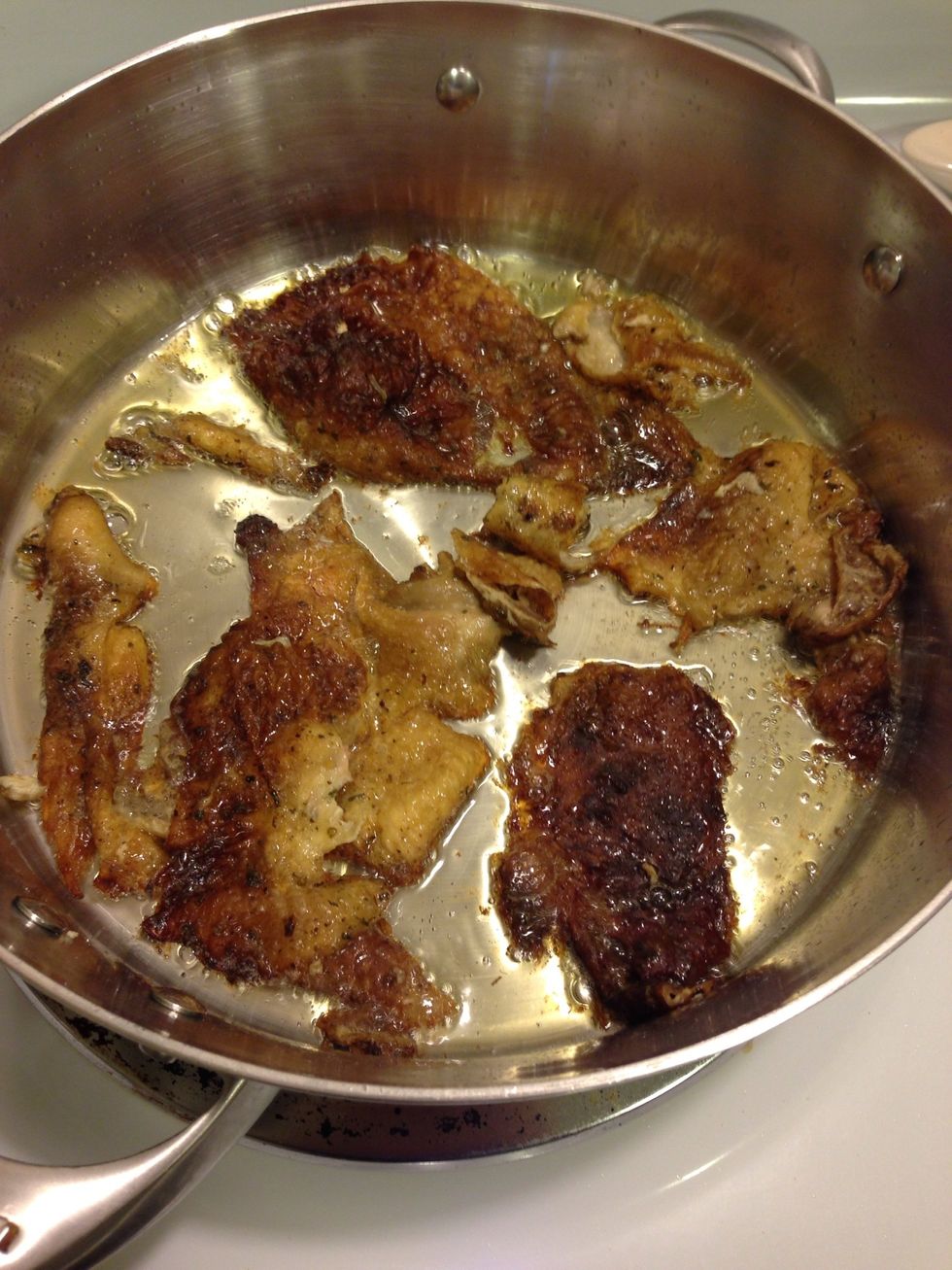 Bonus, I didn't feel like wasting the skin so I added some olive oil to a pan got it nice and hot and added skin, rendered down the fat and made it crispy