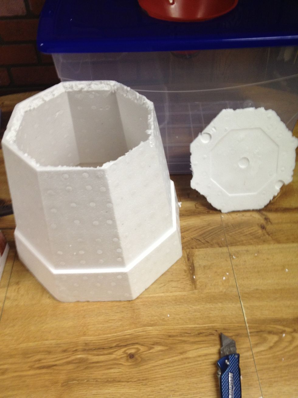 Bottom cut out, but it's not very pretty. Time for good old camouflage duct tape. I like to cover the whole lid. Looks cool! :). We are going to cut 'windows' into the sides of the pot