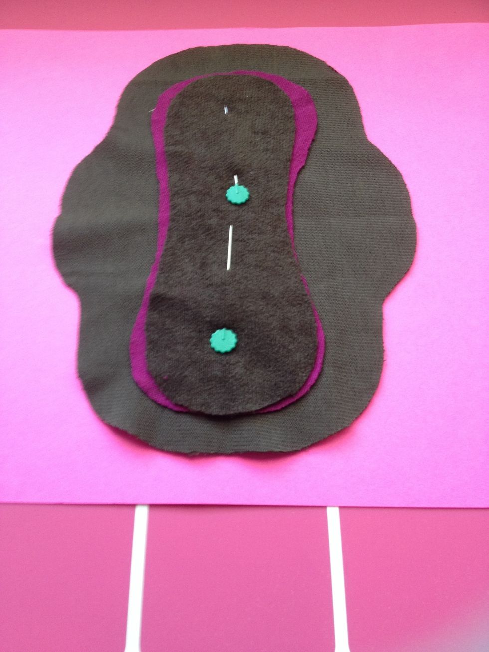 Bottom layer is suede cloth turned "right side" up (non soft side). Middle is one upcycled t-shirt core layer. On top is another suede cloth, cut 1/8 smaller than magenta for sewing. Right side up.