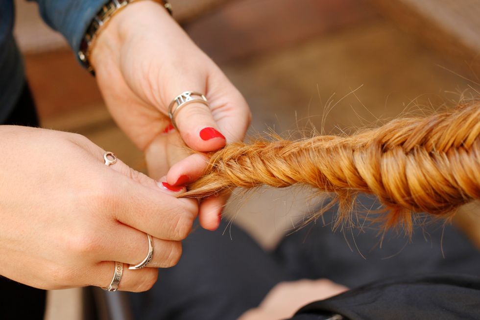 Braid all the way to the ends. This is a great braid for layered hair because the layers will poke out, giving it a lived-in feel.