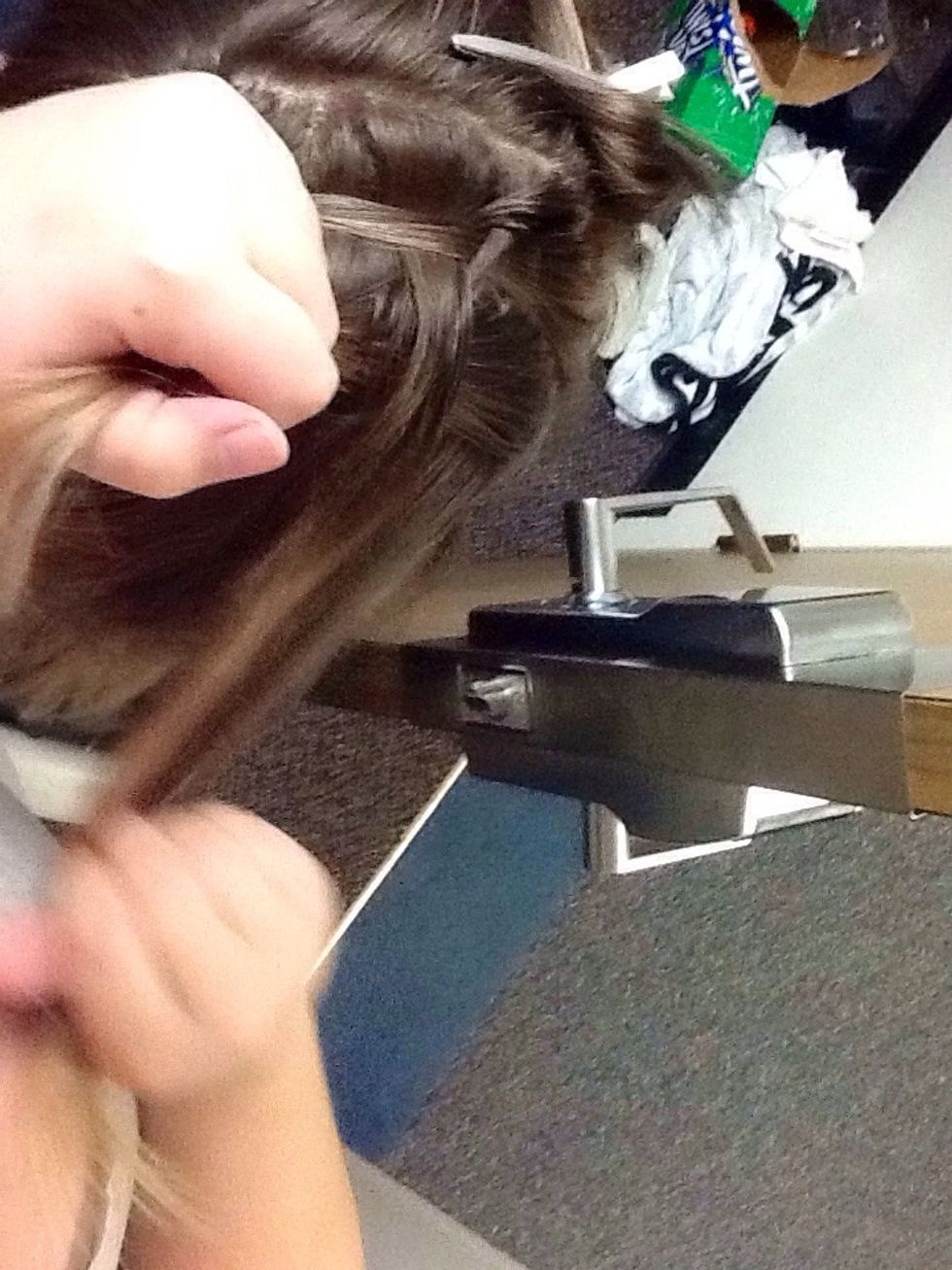 Braid by pulling strands underneath instead of over. This is called a Dutch braid