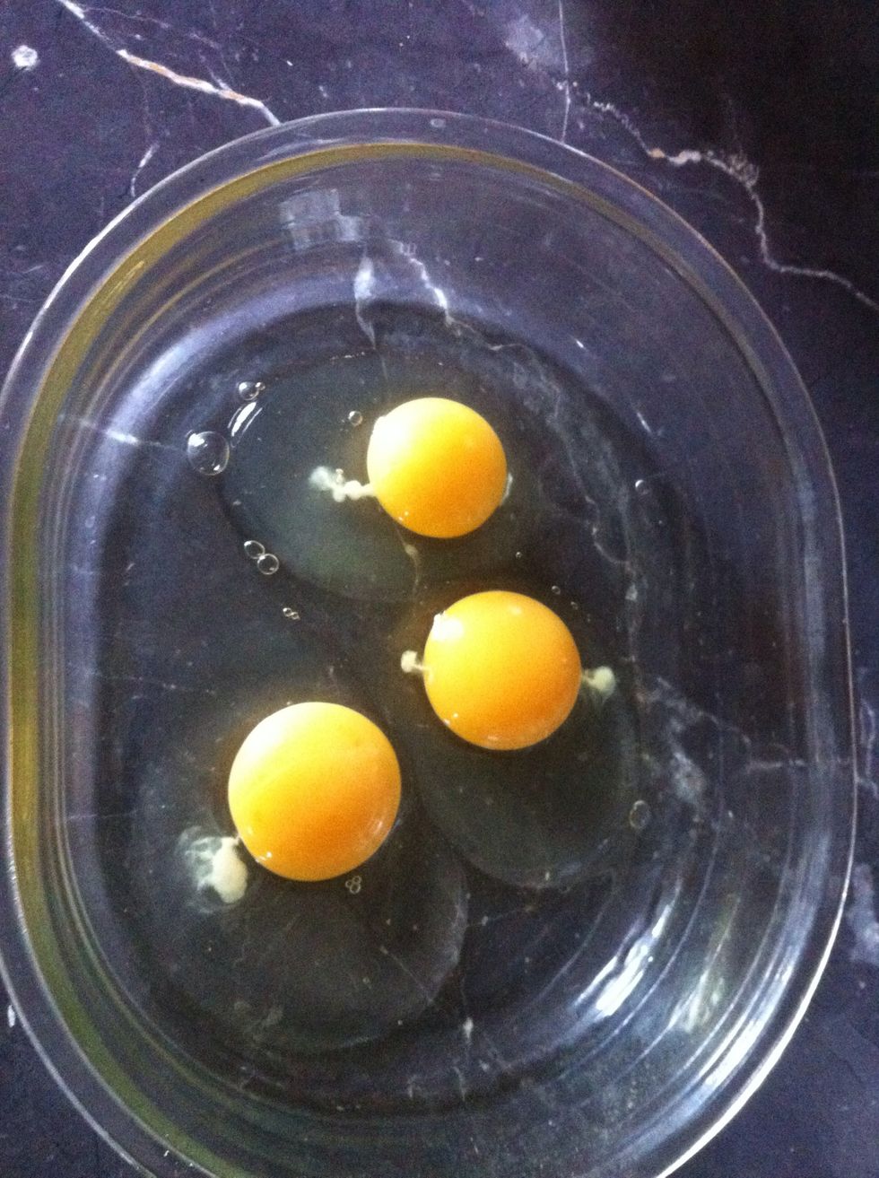 Break 3 eggs into bowl and whisk