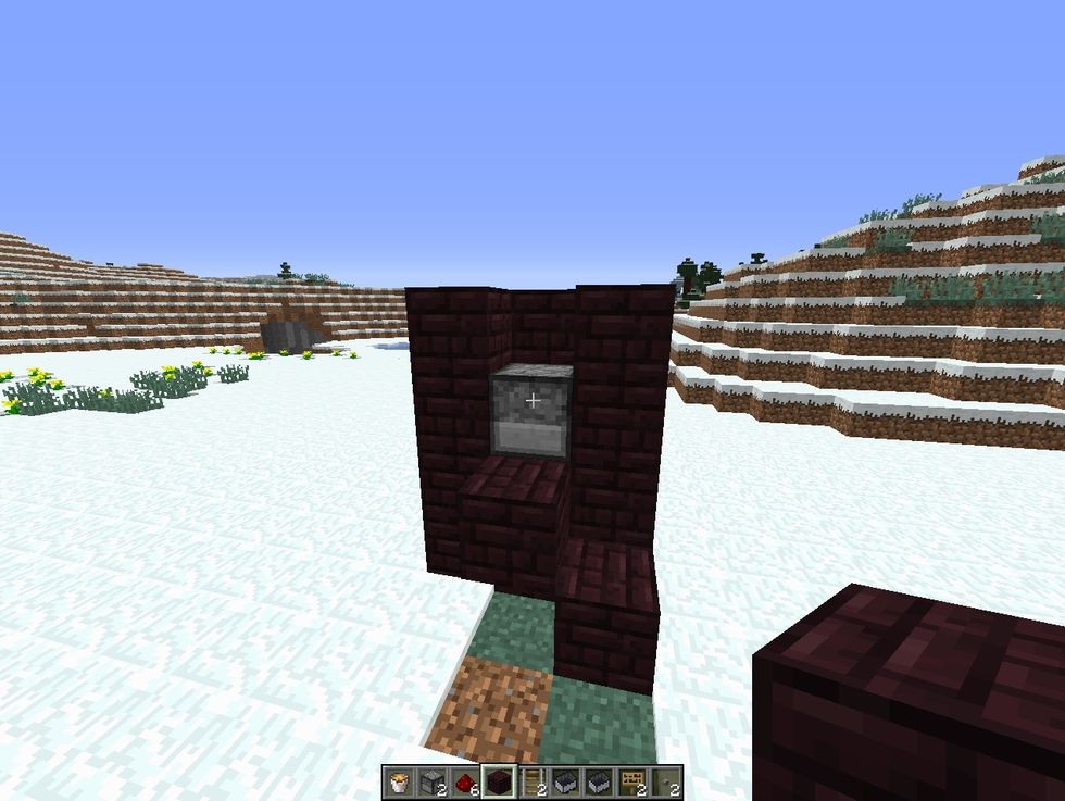 break a block at the top of dispenser on both side and make a stair like structure on both side. the bottom block should go right behind the block where you placed button.