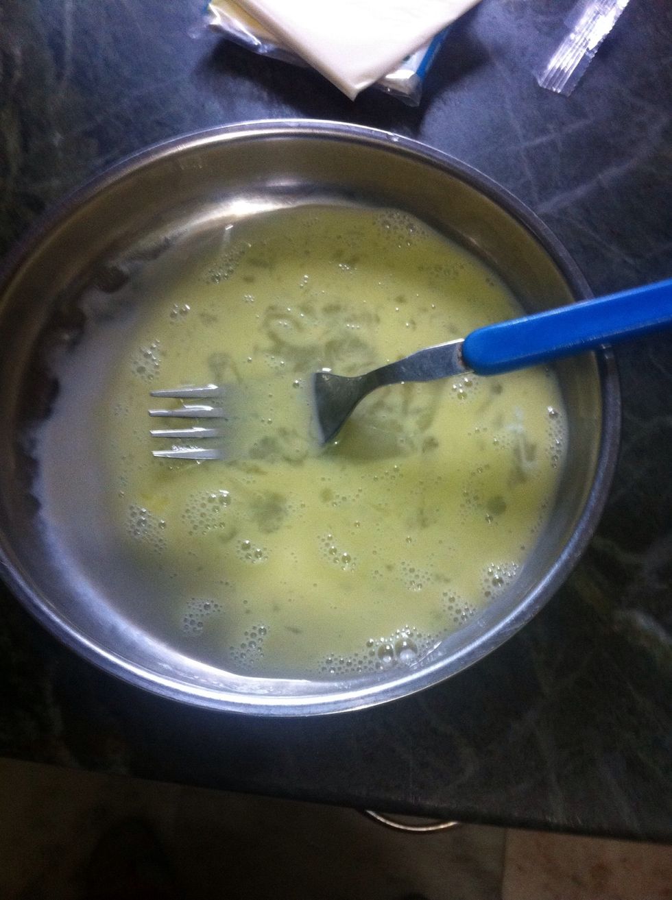 Break an egg. Whisk it.