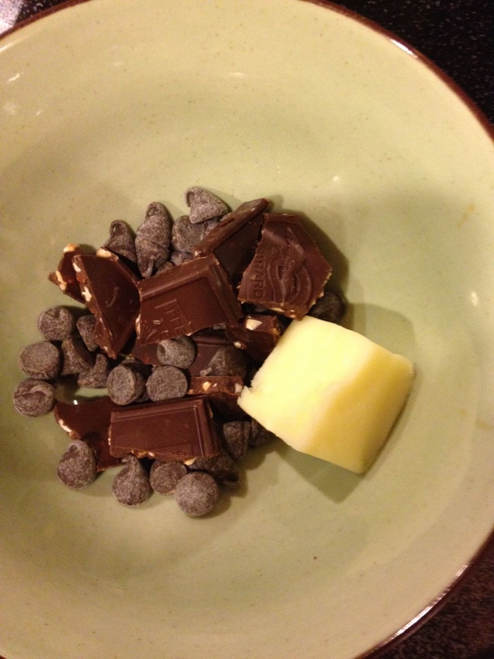 Break chocolate into chunks. Microwave for thirty seconds with butter. Microwave for an additional 15 seconds if needed. Mix to melt completely.