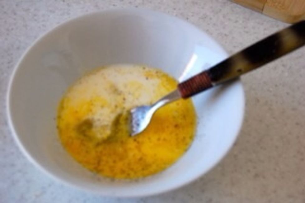 Break egg into bowl and add salt & pepper