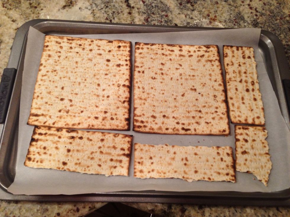 Break matzah into pieces and fit them on the cookie sheet like a puzzle. It's best to leave as little space in between matzah pieces as possible.