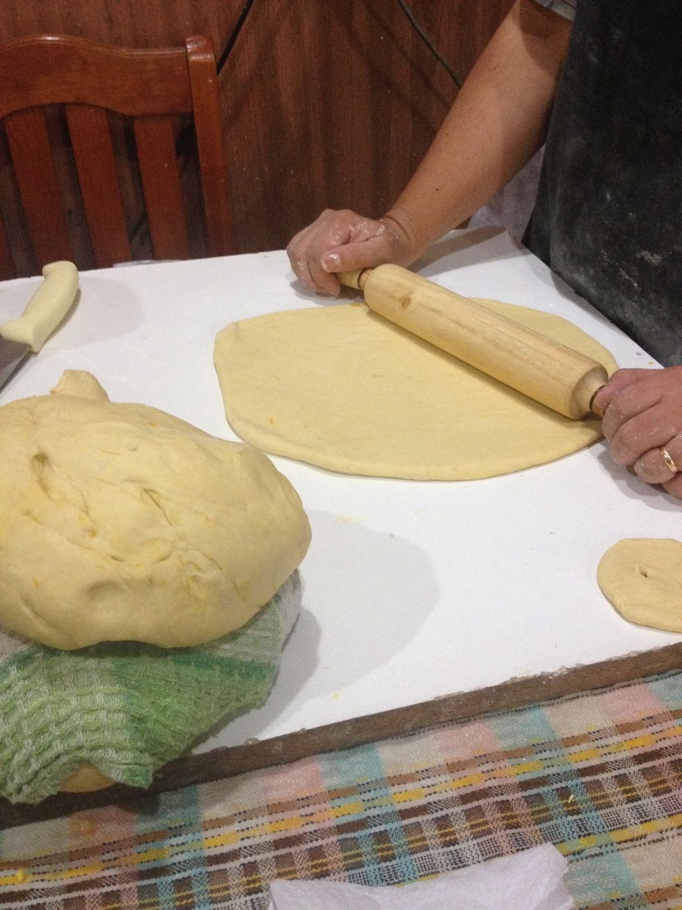 Break off a handful of dough and roll it until it's about a centimetre thick