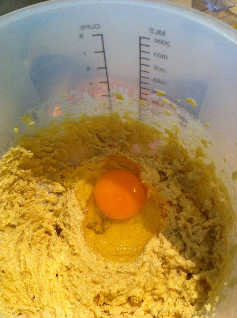 Break one egg into creamed butter and sugar mix