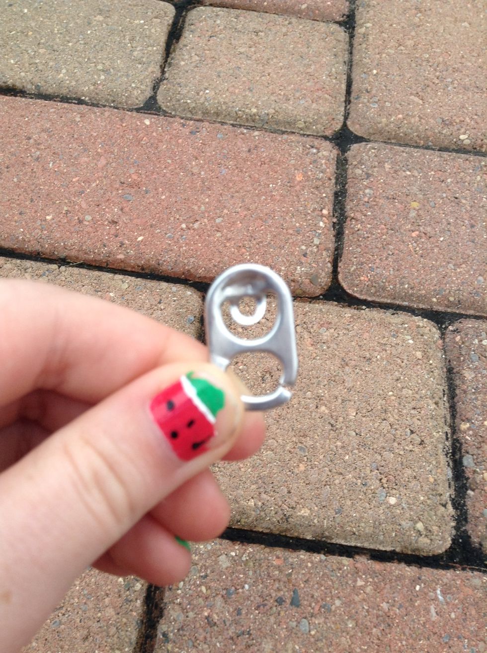 Break one side of the tab agendas a stone or something ( I used scissors I'm not currently stranded in the wild) I accidentally broke the other side but that doesn't matter.