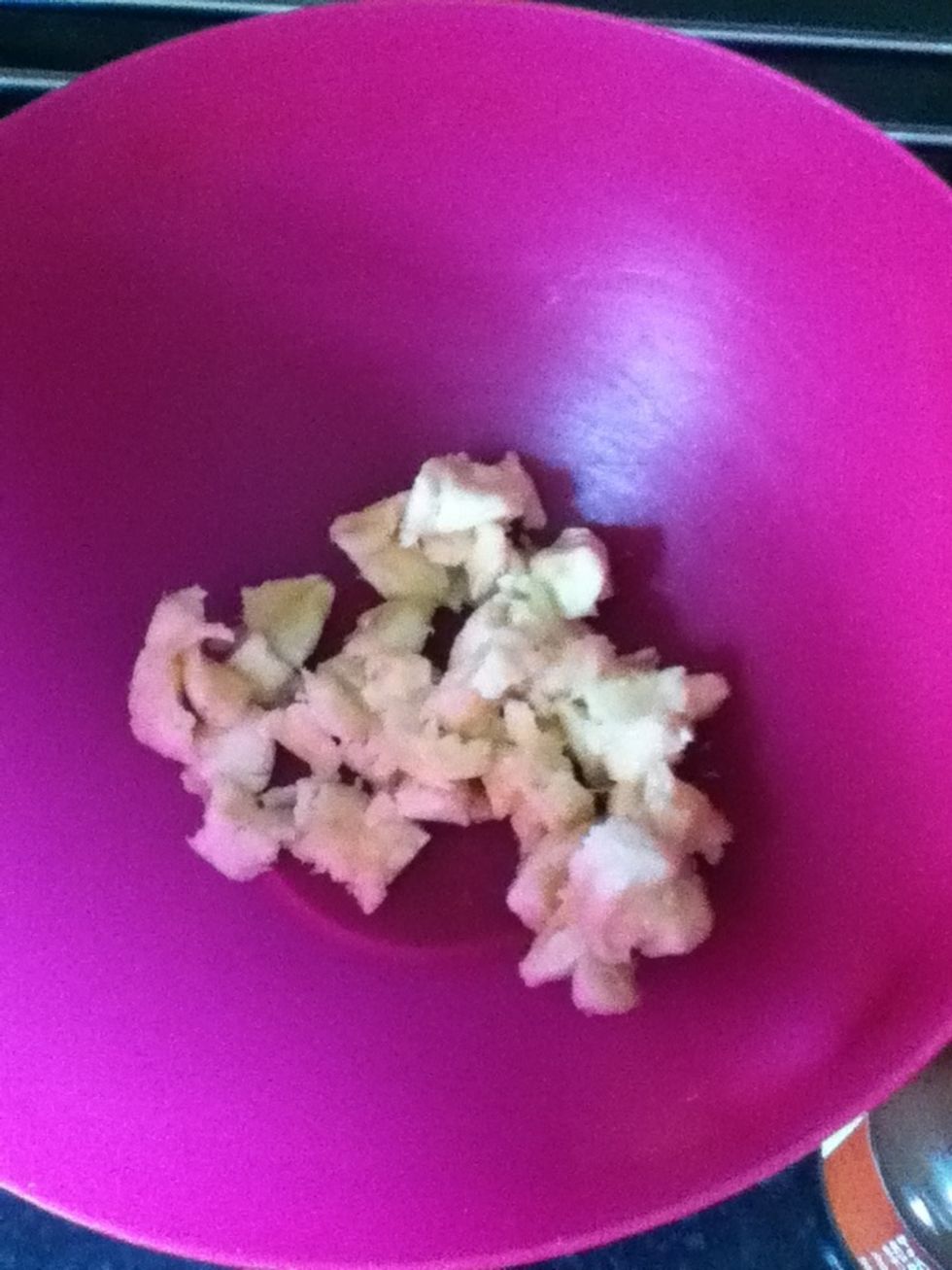 Break the banana up and put it in the bowl