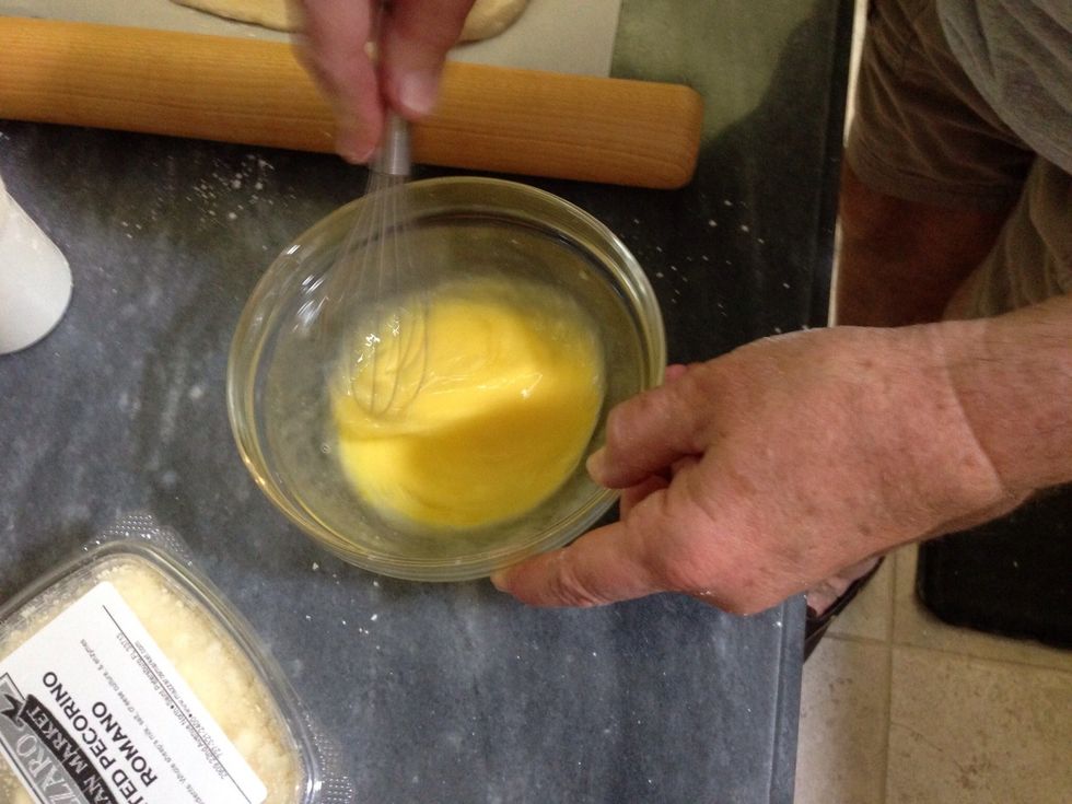 Break the eggs into a bowl and beat until scrambled.