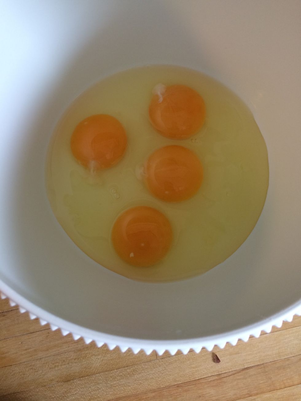 Break the eggs into a bowl.