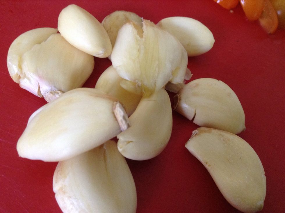 Break the garlic bulb into cloves, leaving them unpeeled, and bash them slightly with the palm of your hand