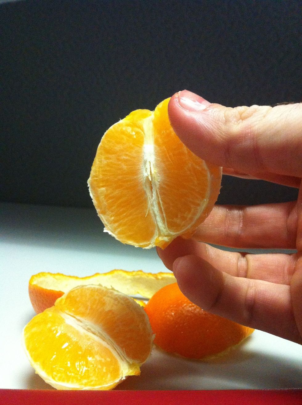 Break the orange into segments