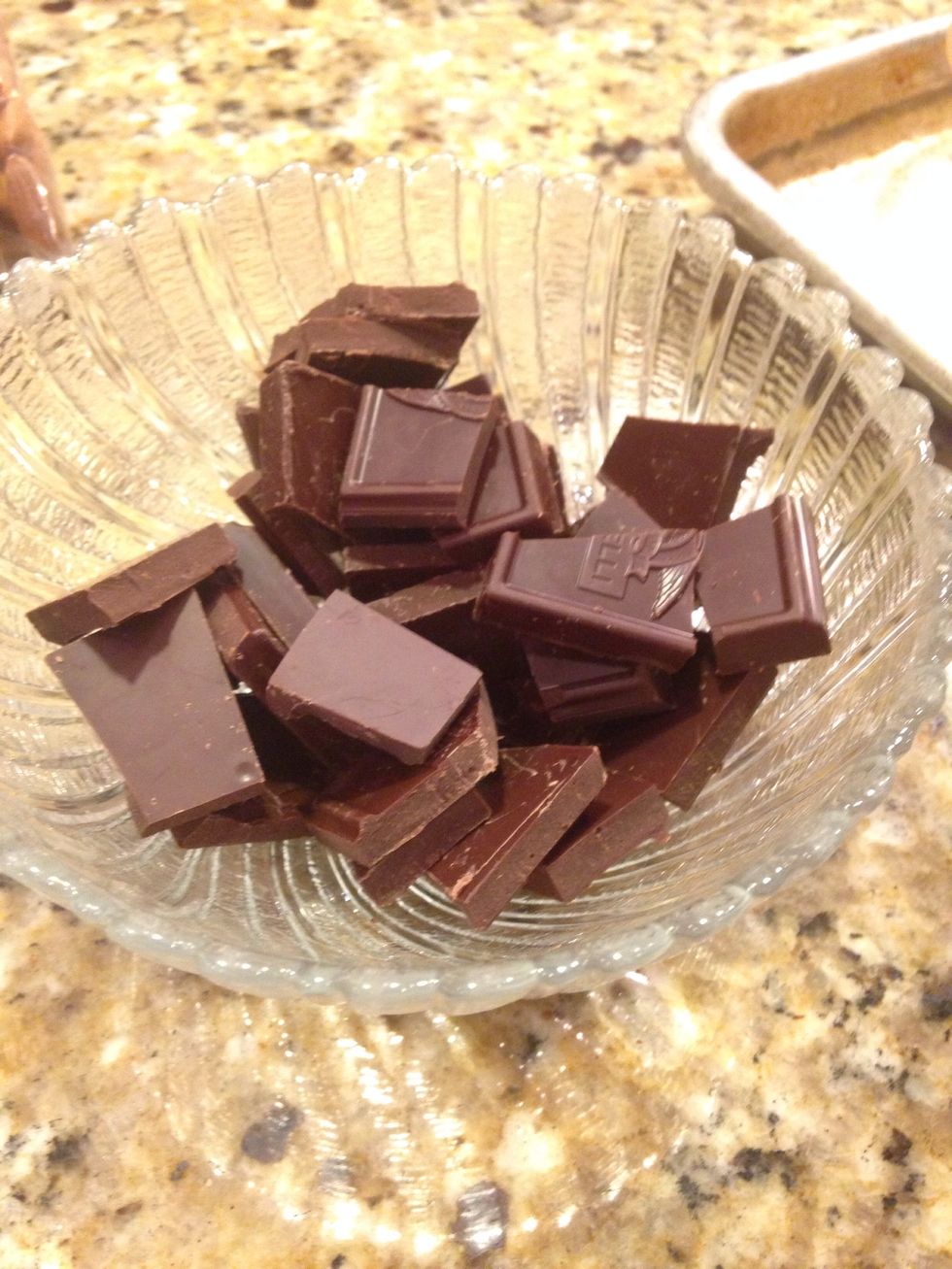 Break the remaining half of the chocolate bar into pieces and microwave for one minute.