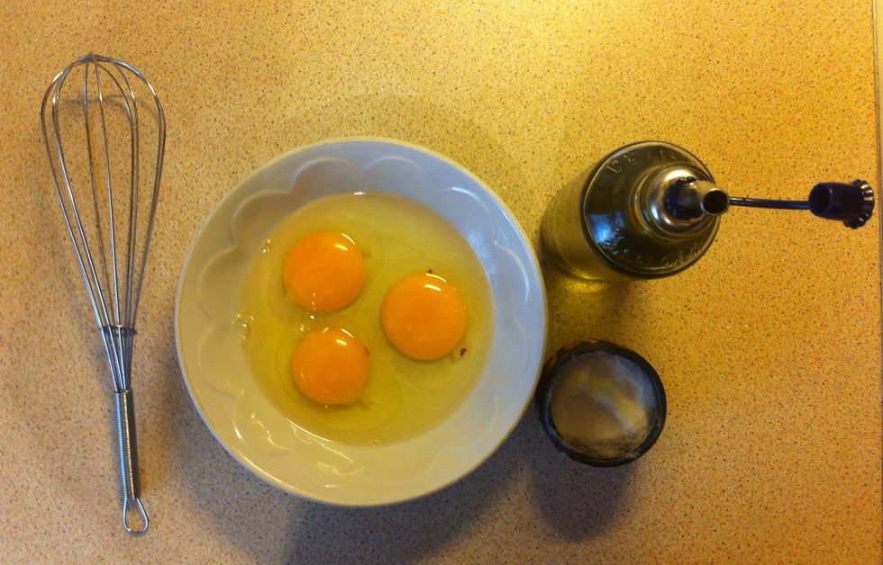 Break three eggs and add salt.