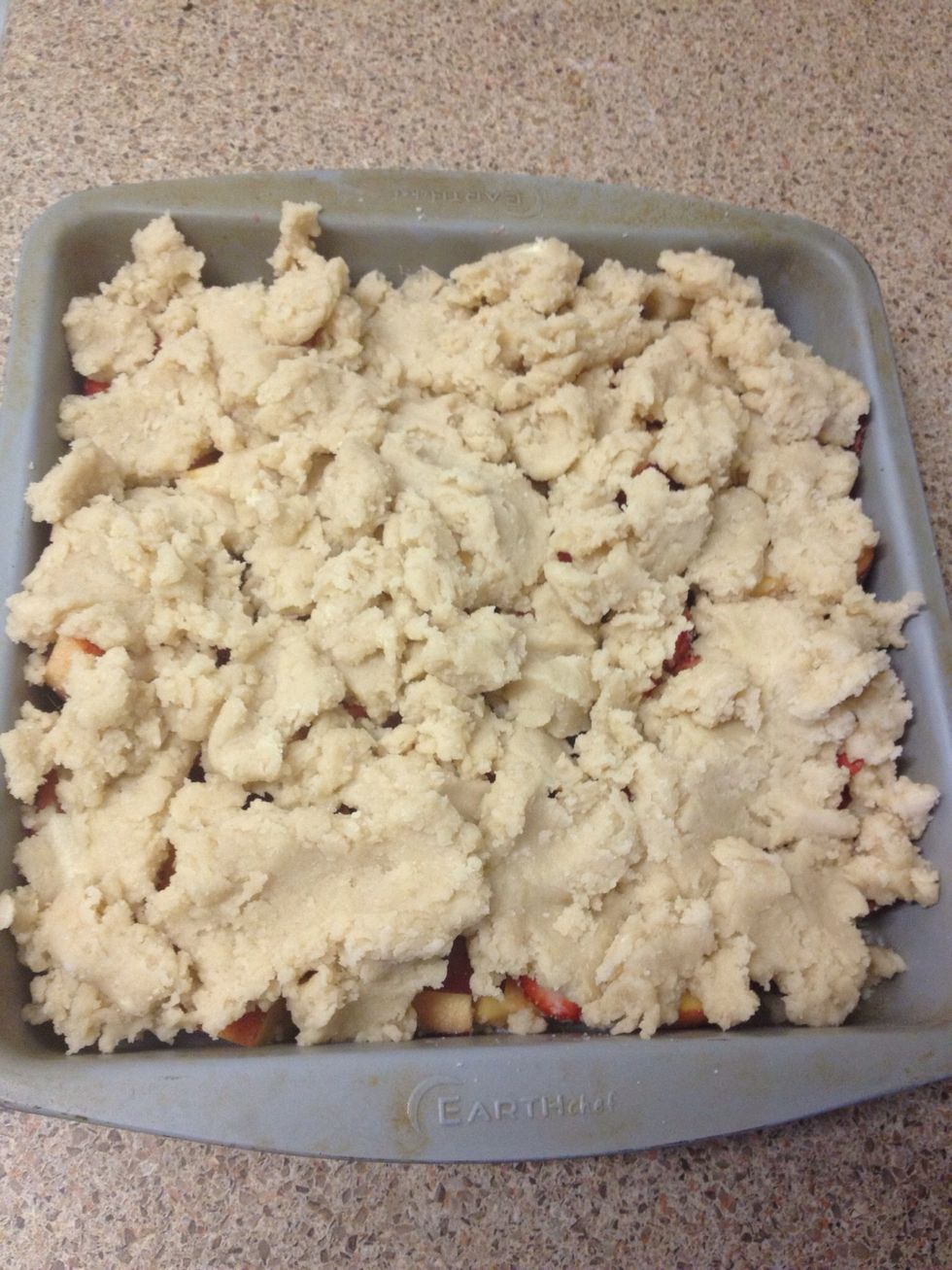 Break up the dough with your fingers and place over fruit.