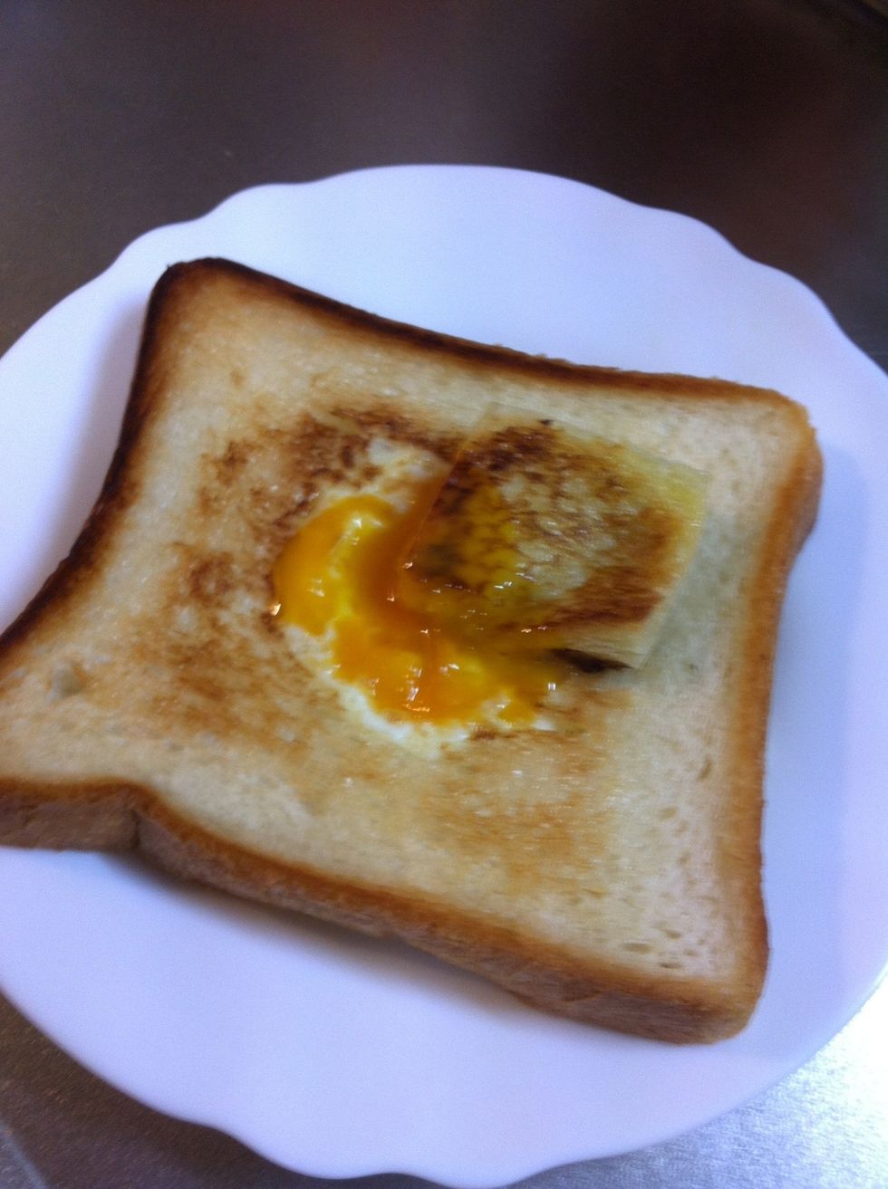 Break up the egg with the piece of the bread.