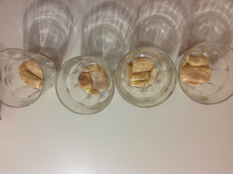 Break up your sponge fingers and cover the bottom of each of your glasses.