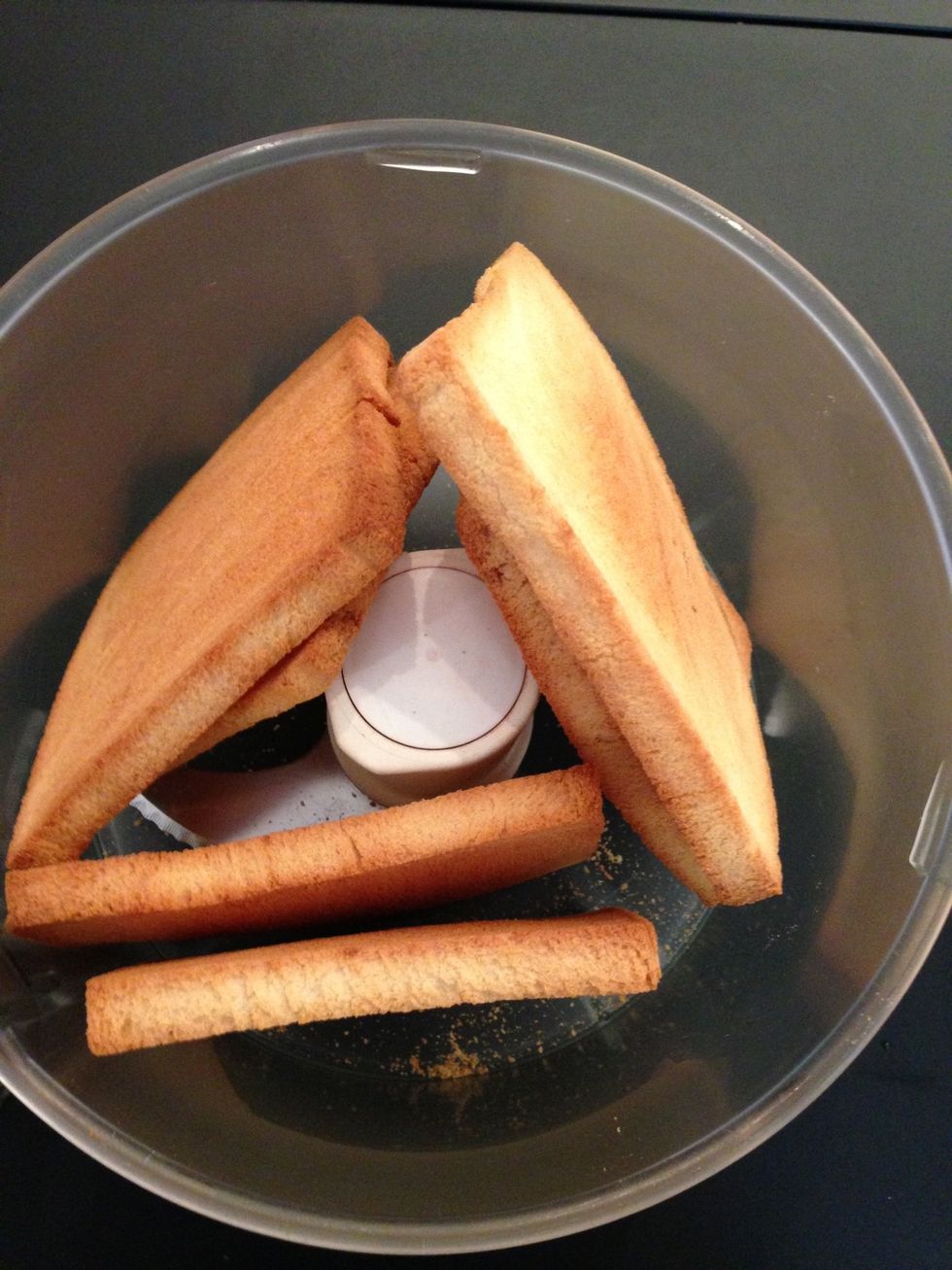 Break your bread to a fine crumble. Add to the cramel