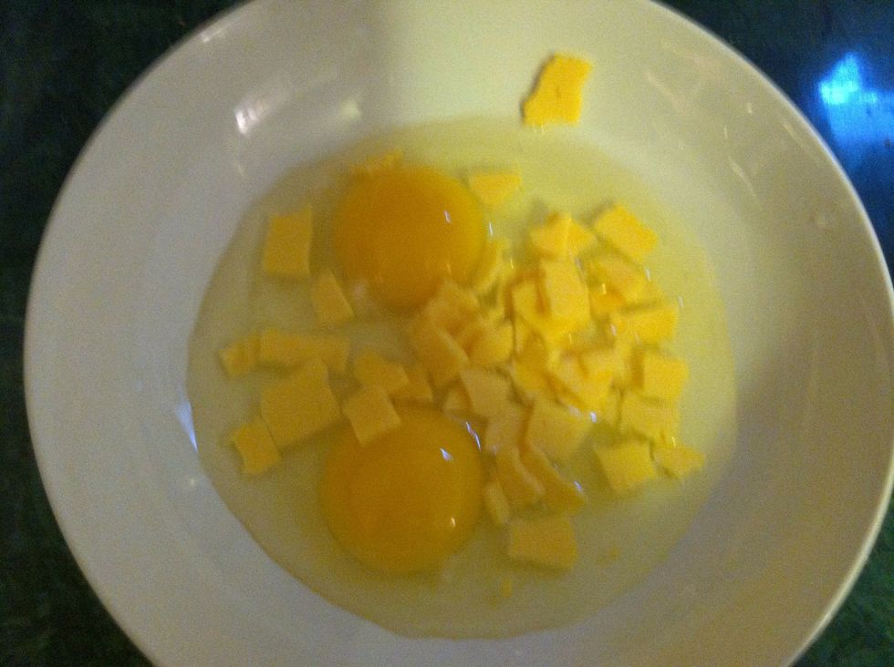 Break your cheese into tiny pieces so they melt faster and mix into the eggs while cooking (I used one slice for my 2 eggs)