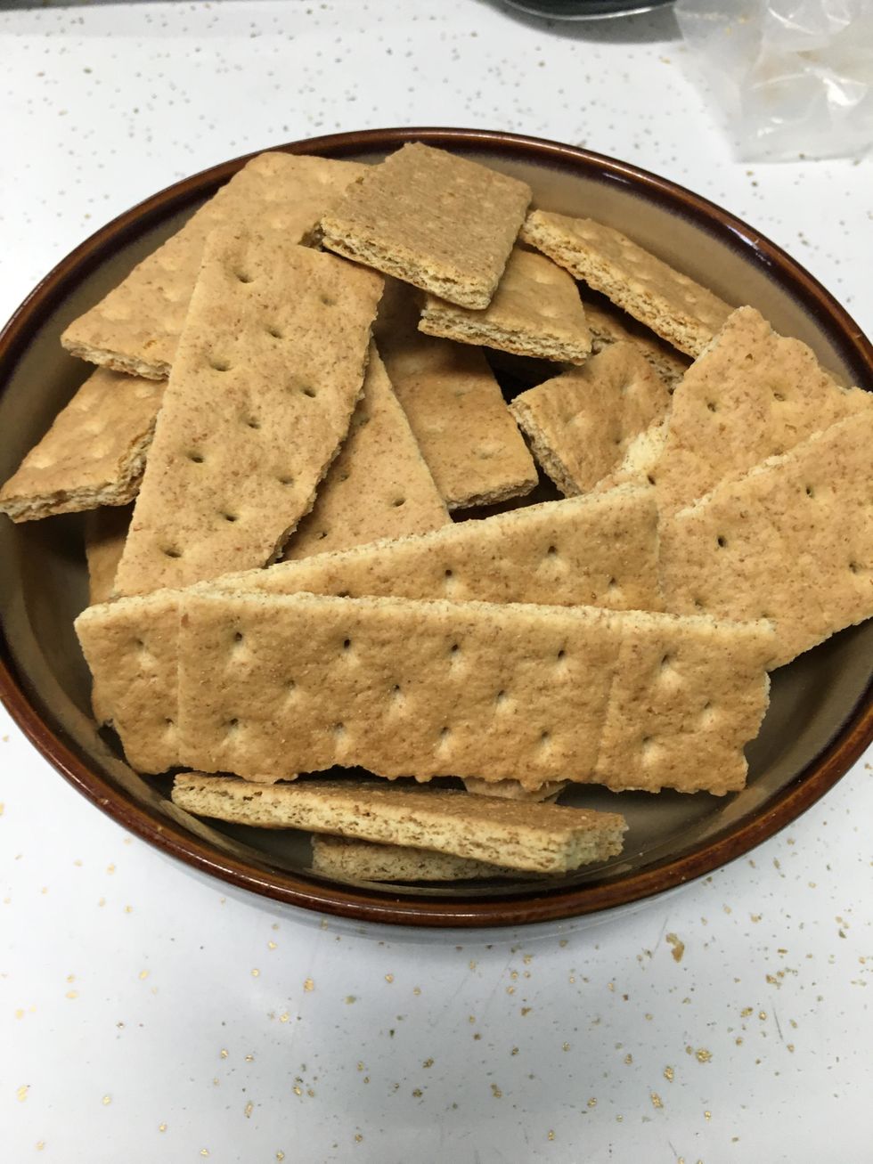 Break your graham crackers into quarters and put them into a serving bowl.