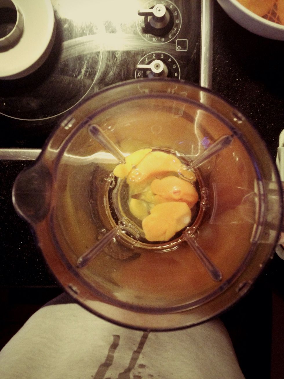 Breaking the 4 eggs and placing it in the blender