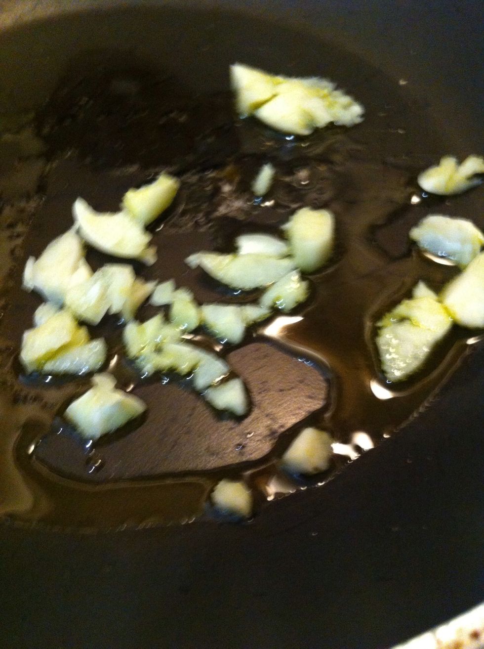 Briefly saut\u00e9 garlic in olive oil