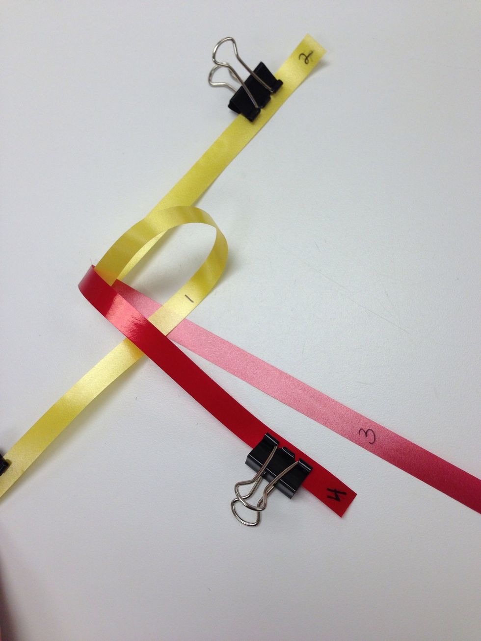 Bring 1 (long yellow) between the reds.