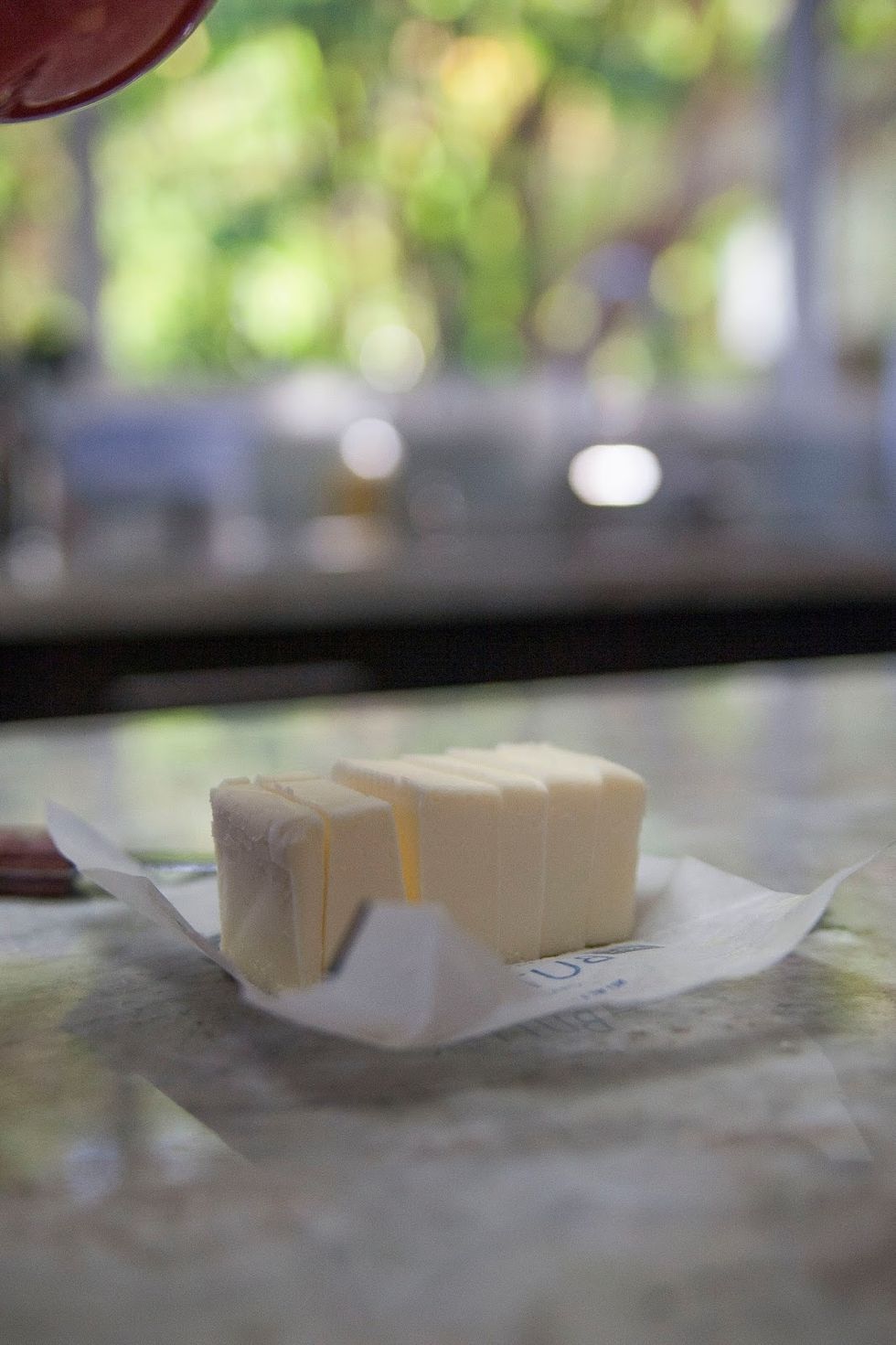 Bring 1 stick of unsalted butter to room temperature Cut it into pieces, set it aside.