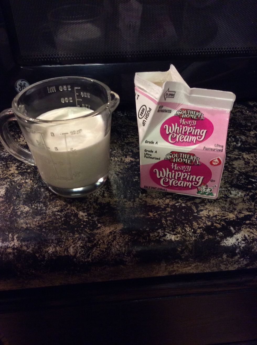 Bring 3/4 cup heavy whipping cream to a rolling simmer.