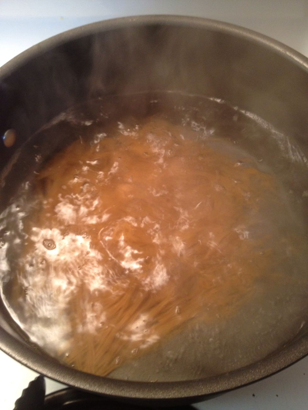 Bring a pot of water to a boil and add your spaghetti noodles. I normally start boiling the water first then start the chicken and sauce.