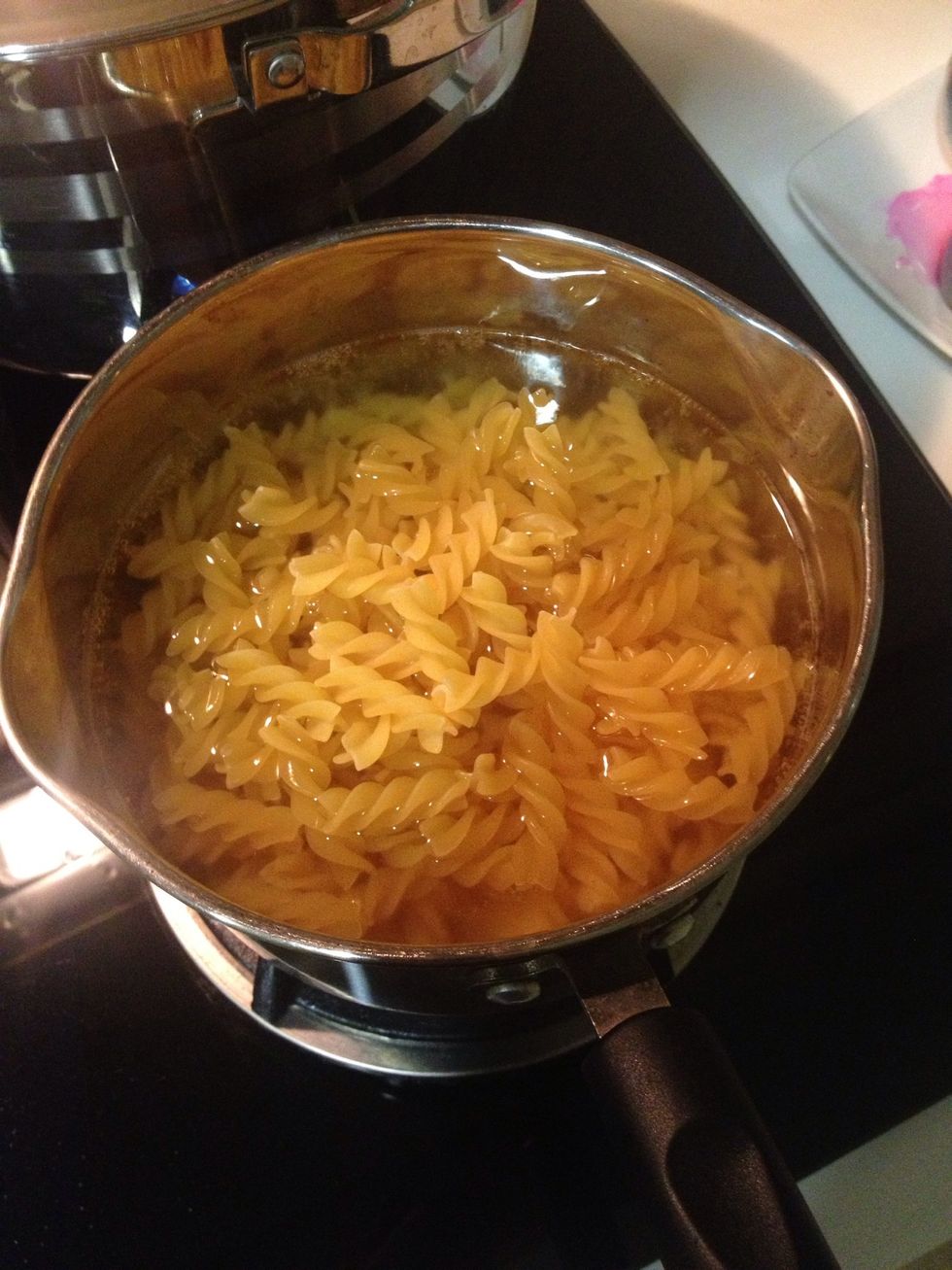 Bring a pot of water to boil. Once the water start boiling, pour your preference pasta. I go with fusilli since I have half a pack leftover.