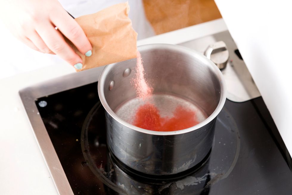 Bring another 1/2 cup of water to boil. Add in your red JELL-O and stir for 2 minutes or until dissolved.