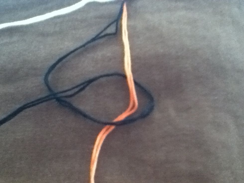 Bring end undef center and over itself. This is another forward knot. Pull knot to top.