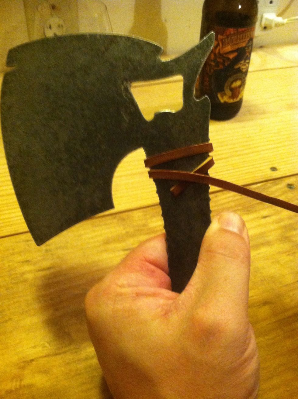 Bring it around the back again to the second opening on the left. Now come across our strap to hold it in place and wrap around the fourth opening on the right.