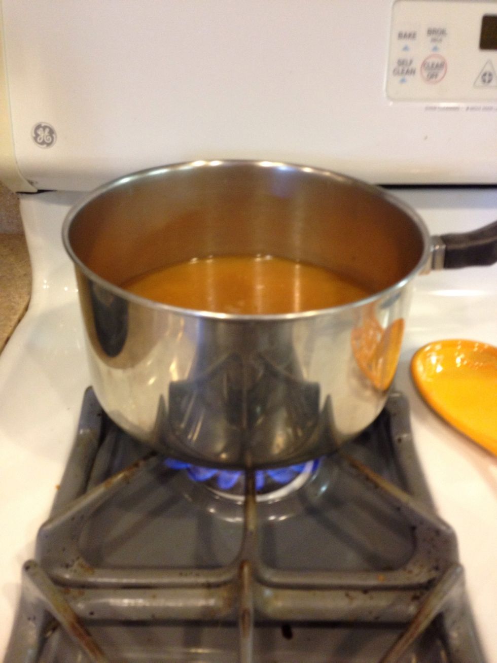 Bring it to just under a boil. It's essential that the liquid you add to your risotto is heated!!