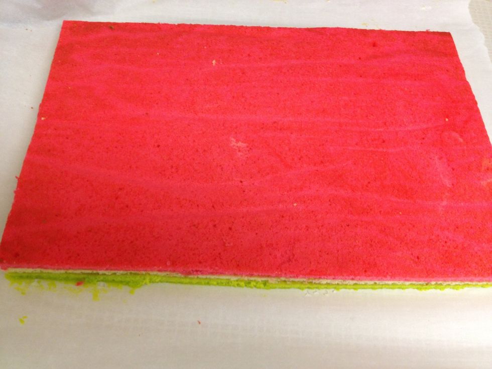 Bring layers to room temperature and trim with a serrated knife. Melt chocolate 3.5 oz at a time (again I used the handy microwave, but you could also use a double boiler).