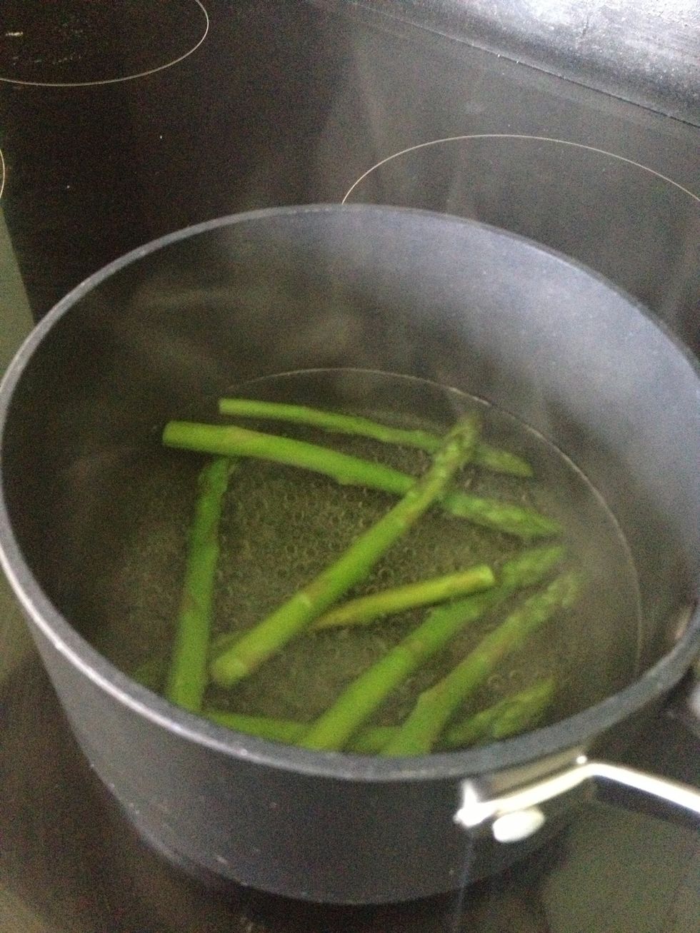 Bring some water to the boil, you may like to add a pinch of salt, then add the asparagus spears. This should only take a minute or two, don't over cook them.