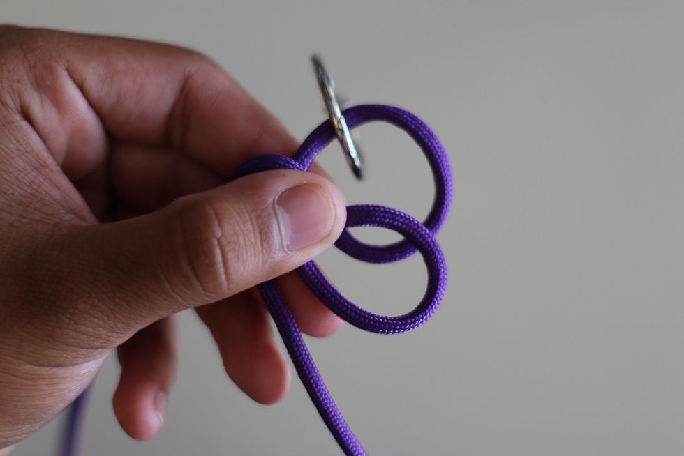 Bring the 2 loops together like so in the picture above.