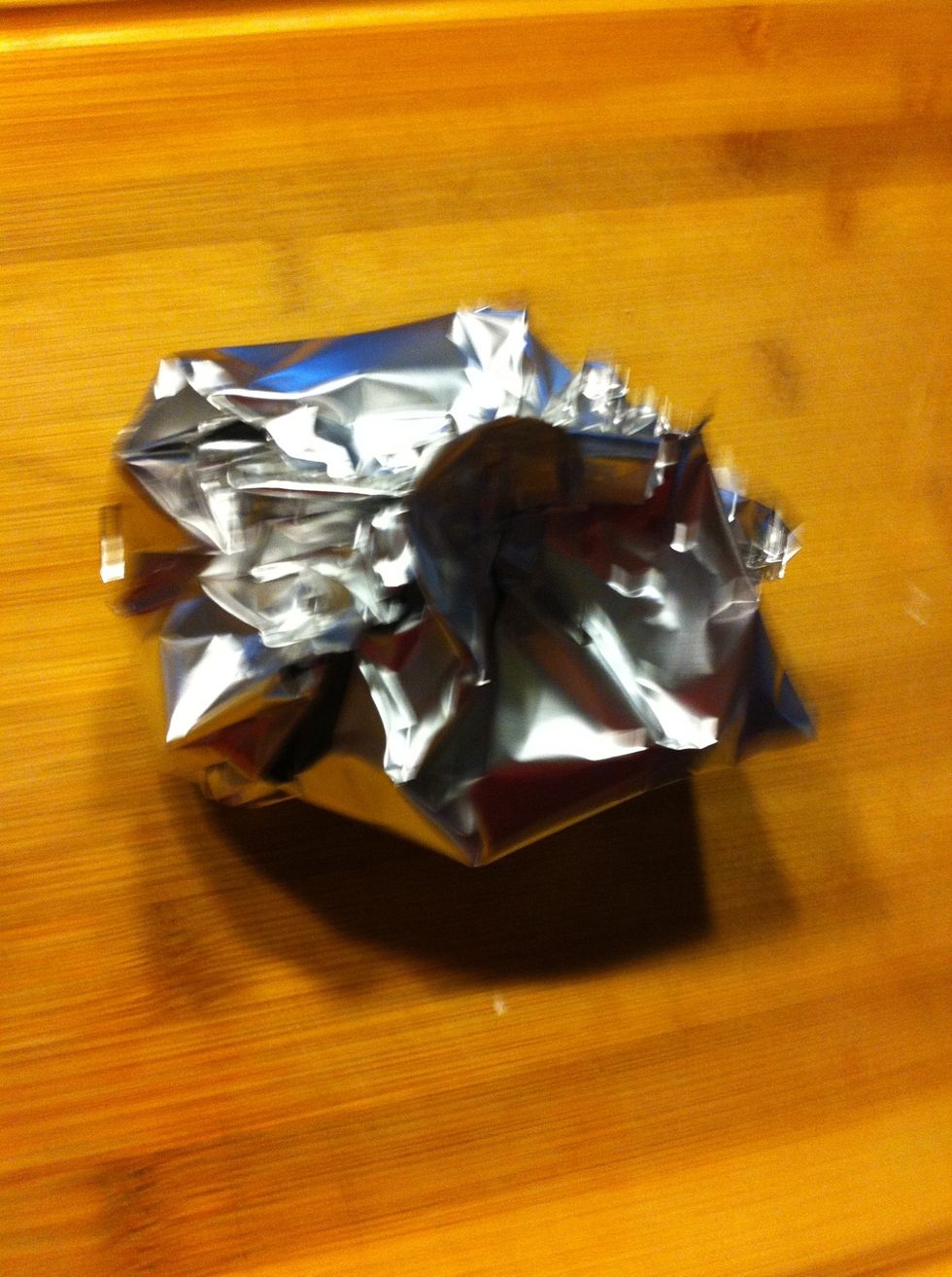 Bring the corners of the foil together and pinch together. Place the garlic in the oven for 60 minutes.