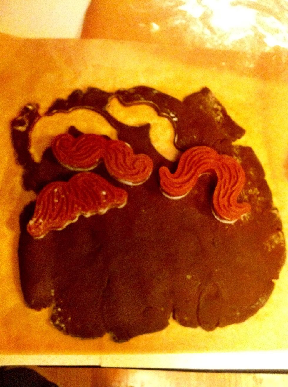 Bring the dough out of the freezer one at a time. There is a perfect window with this dough and cookie cutters. Too cold, dough gets stuck in cookie cutters. Too warm, cookie falls apart.