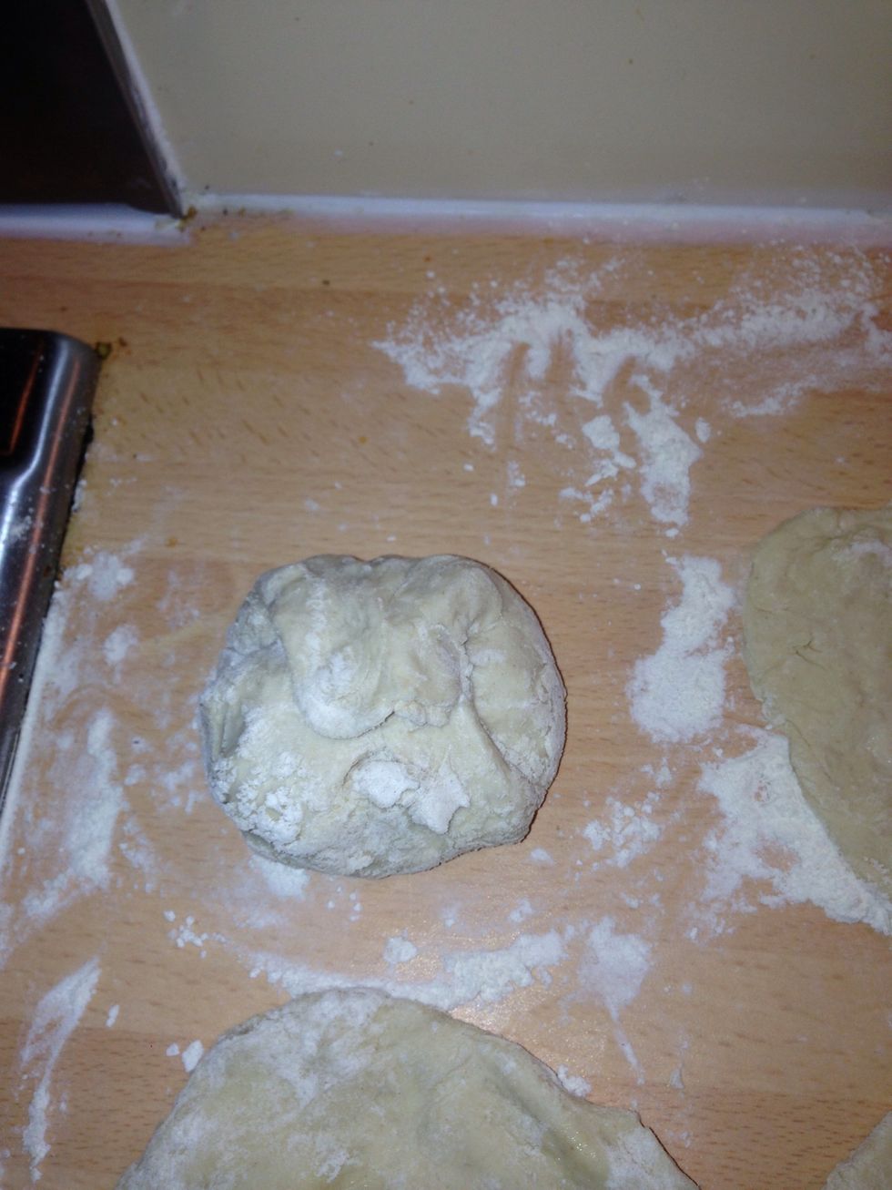 Bring the edges up around the chicken mix and pinch together to seal the bun.