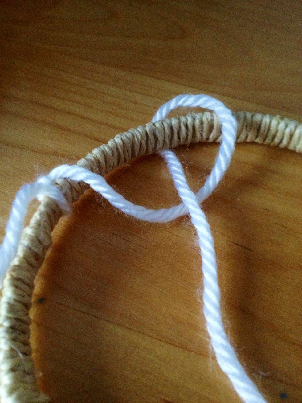 Bring the end under the ring through the loop.