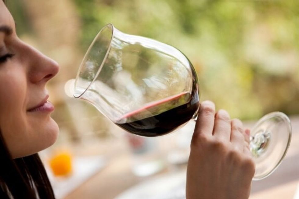 Bring the glass of wine up to your nose & inhale. Can you smell aromas of fruits or spices? This takes some time to get used too, start by seeing if you can pick up one to two scents.