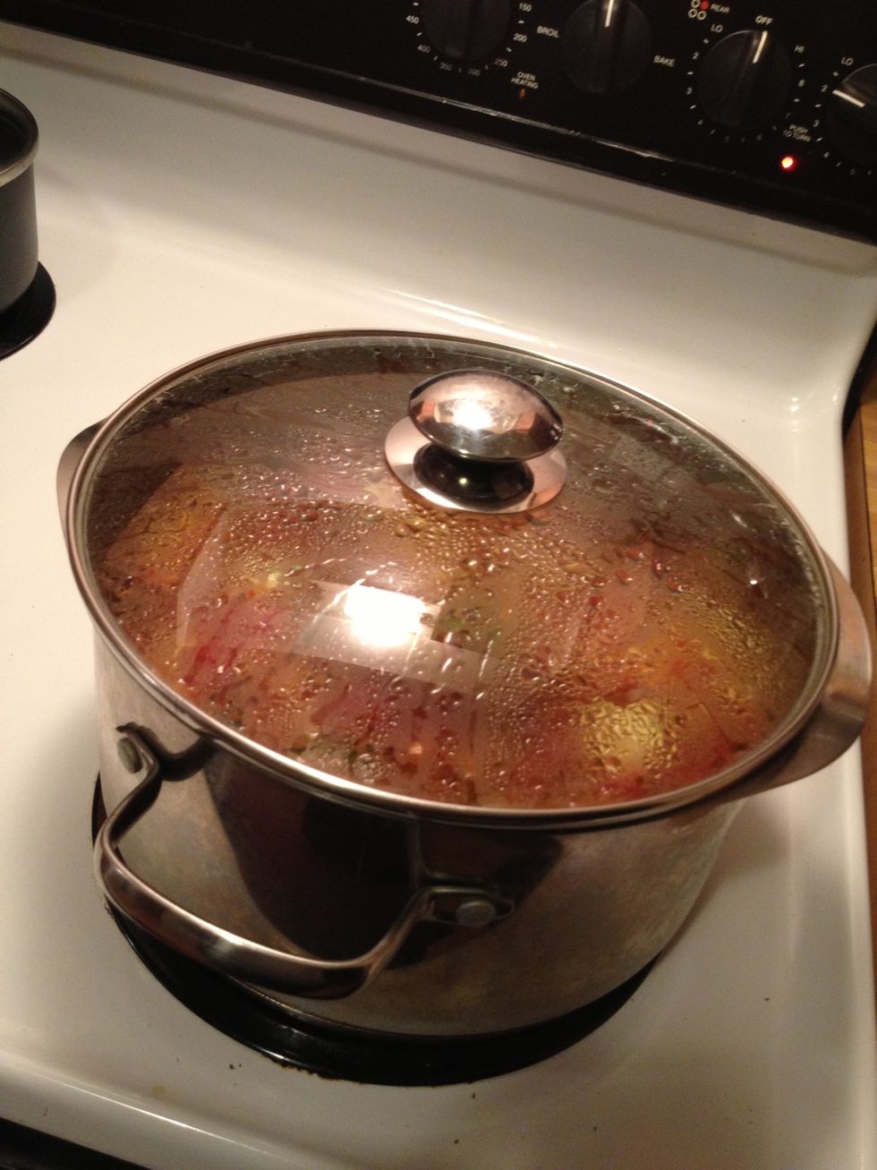 Bring the heat down, cover the pot, and let it simmer for at least 30 minutes. I usually keep it simmering for an hour or so.