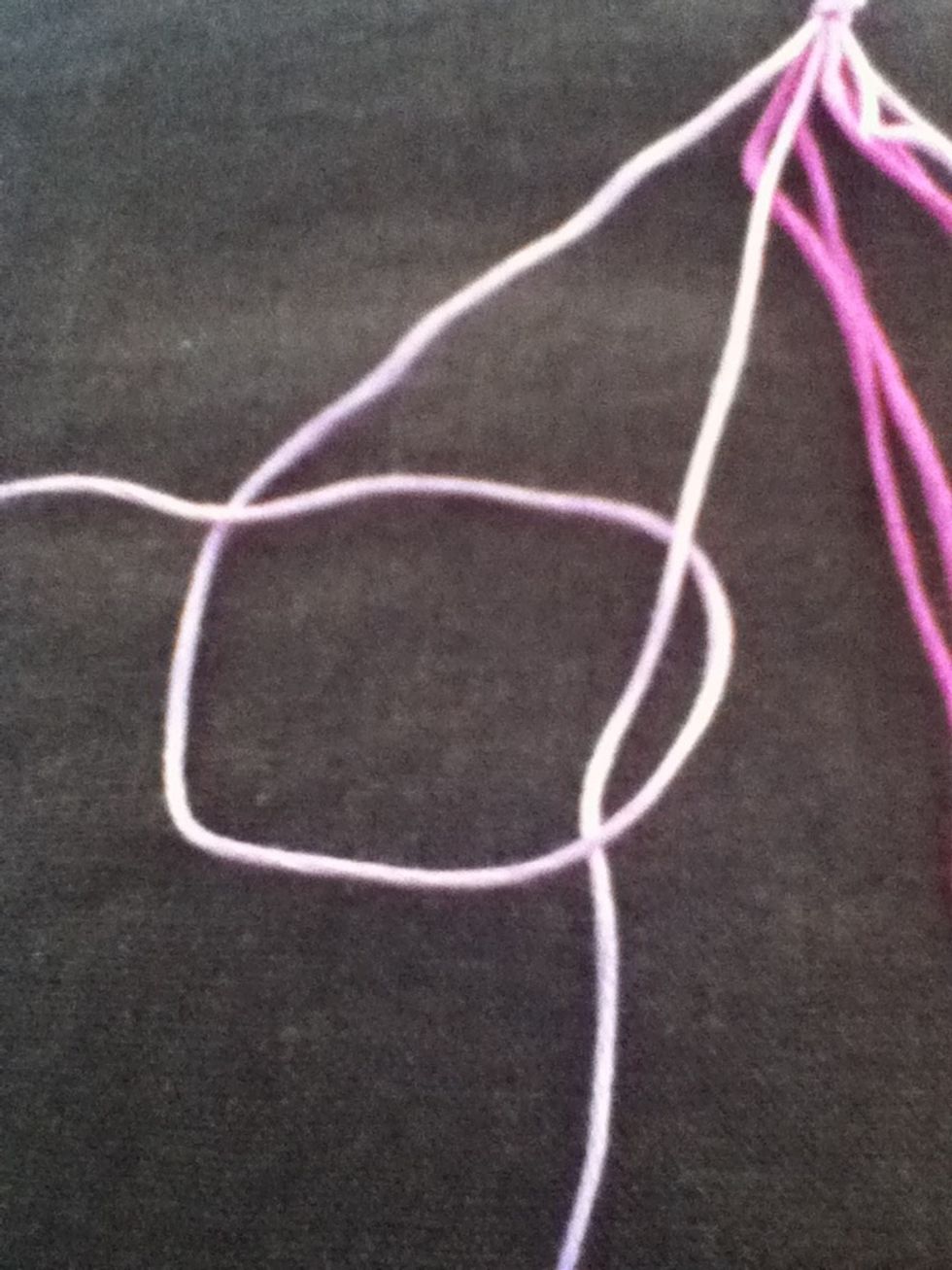 Bring the leftmost strand around the next strand and then back over itself. Bring knot to top of threads. This is a forward knot. Repeat using same two strands.